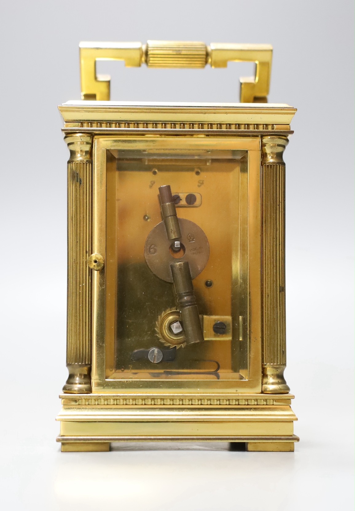 A French brass carriage timepiece, Mappin & Webb, 11.5 cms high.